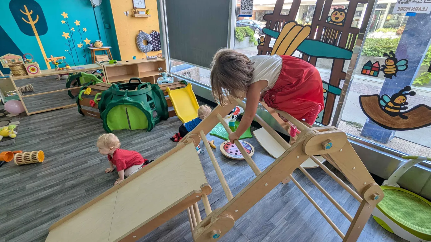 Children sliding down the indoor slides